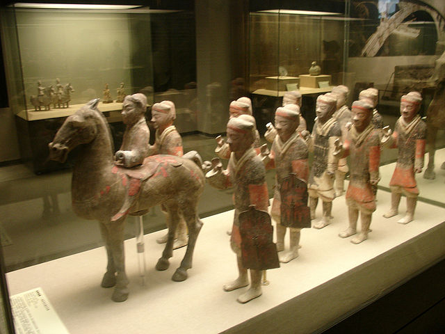 Han-era painted ceramic statues of a Chinese cavalryman and ten infantrymen with armour, shields, and missing weapons