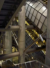 Escalators stacked above one another supported on structural columns within the depths of the deep-level station Westminster underground.jpg