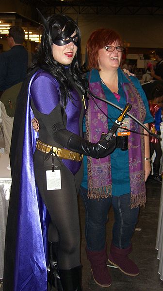 Simone posing with a fan dressed as Huntress, a character whom Simone wrote in Birds of Prey, at the New York Comic Con, October 9, 2010.