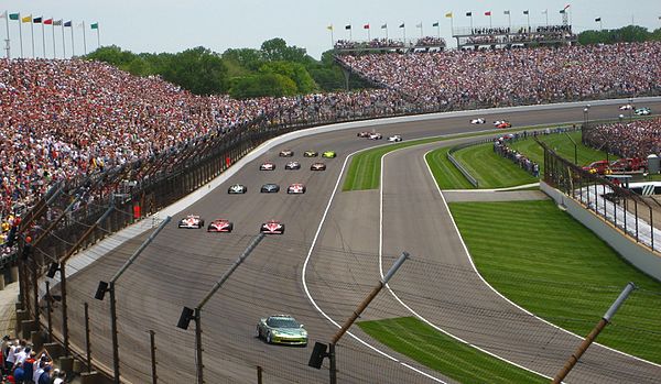 The field entering turn 4, aligned for the start.