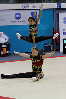 Kieran Whittle (bottom) and Farai Bright-Garamukanwa at the 2014 Acrobatic Gymnastics World Championships. 2014 Acrobatic Gymnastics World Championships - Men's pair - Finals - Great Britain 02.jpg