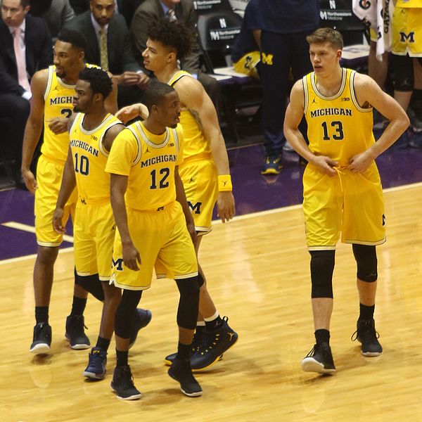 The starting 5 (left to right): Zak Irvin, Derrick Walton, Muhammad-Ali Abdur-Rahkman (front), D. J. Wilson and Moe Wagner