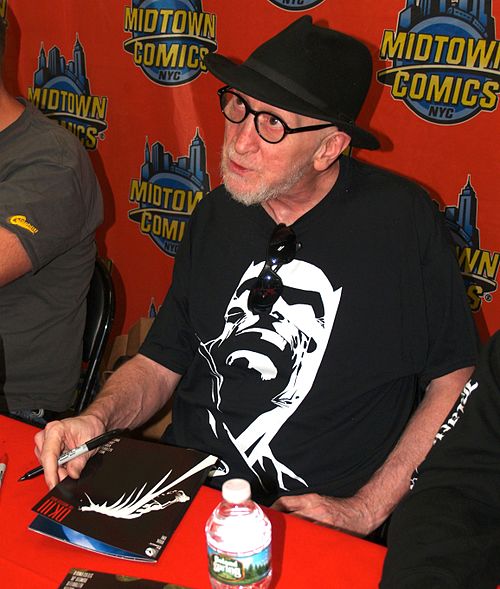 Frank Miller signing a copy of the book during an appearance at Midtown Comics