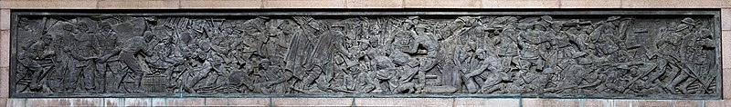 A ten-metre-long bronze relief, over the west door by Rayner Hoff. ANZAC War Memorial Bronze Relief 1.jpg