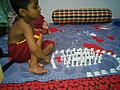 A boy playing and thinking.jpg