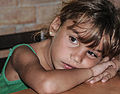 * Nomination A girl waiting for her food. At the end of a beach day dehydrates the body, especially the children, she waits impatiently for his only meal of the day after having had a full day of beach, a typical girl Margarita Island --Wilfredor 01:46, 27 October 2012 (UTC) * Decline Focus is not on the eyes. --ComputerHotline 16:13, 27 October 2012 (UTC)