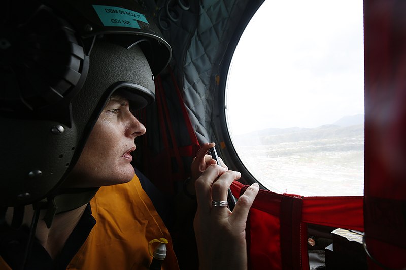 File:A humanitarian expert from the Department for International Development looks out of the window of an RAF Chinook helicopter as part of a needs assessment mission to Dominica. (37218097541).jpg