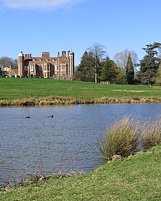 Madingley Hall lake. Across the lake to Madingley Hall (geograph 6402209 by John Sutton).jpg