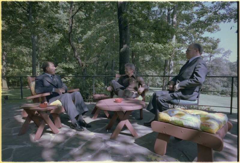 File:Anwar Sadat, Jimmy Carter and Menahem Begin hold one of their Camp David meetings on the Aspen Cabin patio. - NARA - 181112.tif