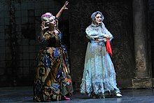 As the Stepmother in Alfred Rodrigues's Cinderella, with Carla Fracci as the Fairy Godmother. Cenerentola lauri fracci.jpg