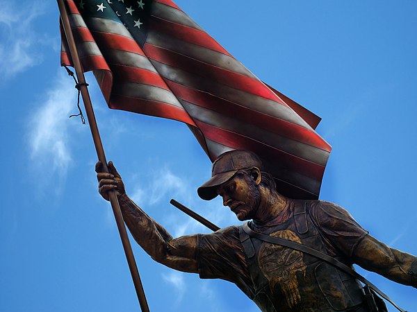 A memorial statue to Chris Kyle in Texas features the skull on his vest, as he is credited with popularizing the symbol in the US military.