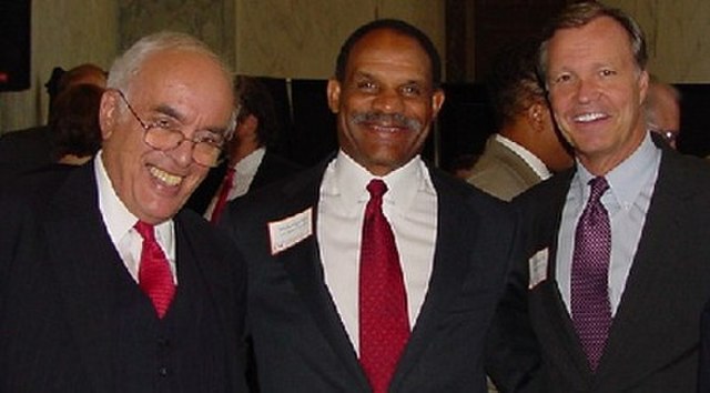 Novak with Mike Garrett and Christopher Cox in 2003