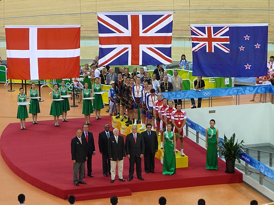 The bronze medal winning New Zealand men's team pursuit cyclists on the podium