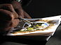 Dolceacqua43 - Artista locale mentre dipinge un acquarello.jpg