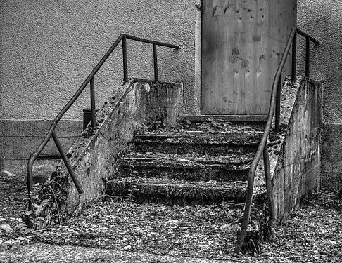 Rotten stairway of an administration building of the former nitrocellulose factory owned by Dynamit AG. Frauenwald, Landsberg am Lech, Bavaria, Germany.