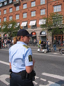 The quality of the service provided by the police, such as the pictured Police of Denmark, is a component of security sector governance and reform Female police officer of Denmark.jpg