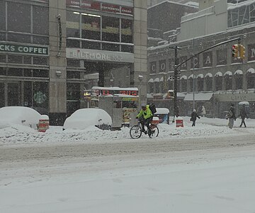 bicycle rider and snow in Manhattan, New York City (January 23)