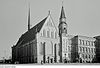 simple church structure with a small steeple, originally built for Dominican friars, changed through the centuries, adjacent to university buildings to the right