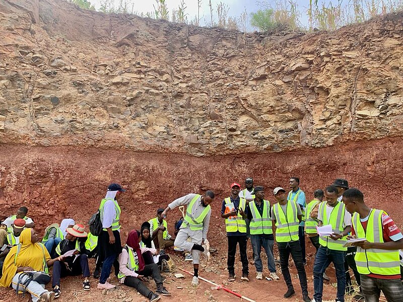 File:Gombe state University Geography students visits an Escavated hill showing soil profile with its horizons at Waka biu, Borno state 05.jpg