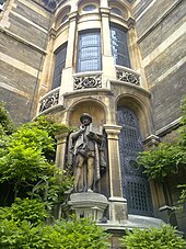 Statue of Stephen Perse, founder of the Perse School in Cambridge, set into the northeast corner of the Waterhouse Building Gonville and Caius exterior framed sculpture.jpg