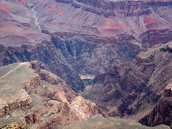 (units 1-2-3 of 5 units) Shinumo Quartzite cliffs upon colorful Hakatai Shale upon horizontal thin beddings of Bass Formation (upon Vishnu Basement Ro