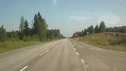 Highway 5, a typical two-lane road. Junction and coach stop on the right-hand side.
