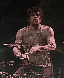 Joey Castillo with the Eagles of Death Metal 2009 (cropped).jpg
