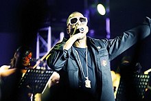 West (pictured) was criticized for his interruption of Taylor Swift's VMA speech. The incident reportedly put the fate of the Fame Kills tour in question. Kanyecolorconcert.jpg