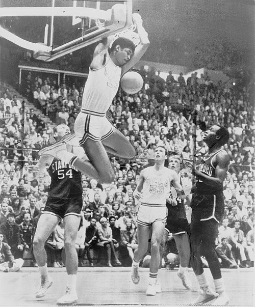 Lew Alcindor (later Kareem Abdul-Jabbar) makes a reverse two hand dunk.