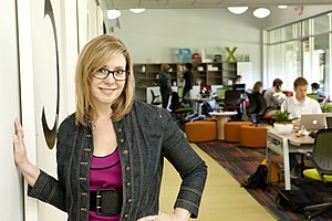 Link Coworking interior with Liz Elam posing.