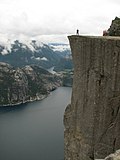 Lysefjorden - Man standing on Preikestolen.JPG