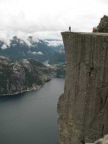 220px-Lysefjorden_-_Man_standing_on_Preikestolen.JPG