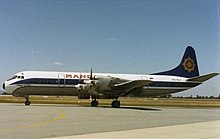 Un Lockheed L-188A Electra de Mandala sur l'aéroport de Perth au début des années 1990