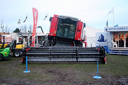A Massey Ferguson combine fitted with the hillside leveling option
