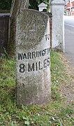 Milestone on Wigan Road, Ashton-in-Makerfield - north side showing mileage to Warrington