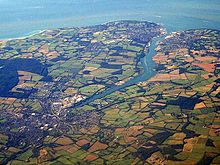 The River Medina's estuary and harbour at East Cowes and Cowes (upper right) is a ria, or a flooded river valley which was previously a feature of the River Solent. Newport-cowes wb.jpg