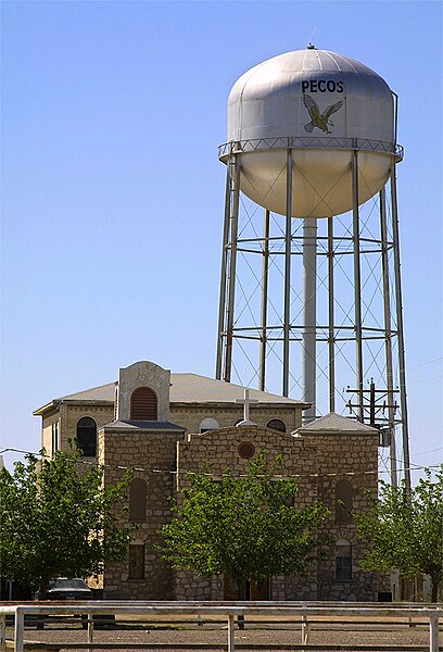 Water tower and the Santa Rosa church in Pecos, Texas