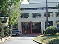 Front view of the Potter Building. Showing the entry to the Potter Library (Secondary School), branches of one of the many Moreton Bay Fig that are found on the grounds, and the two levels of science laboratories located above the Potter Library.