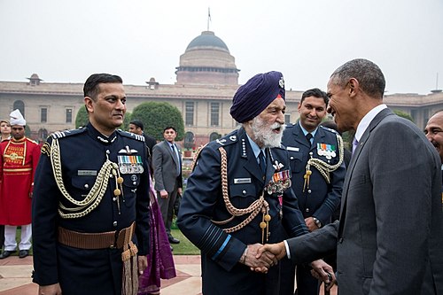 U.S. President Barack Obama greets Singh in the forecourt of Rashtrapati Bhawan during India's republic day parade, 2015.