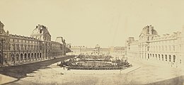 The Louvre in 1853 Reunion des Tuileries au Louvre 1852-1857 Getty Museum vol1 05 View of the Cour Napoleon toward the Tuileries.jpg