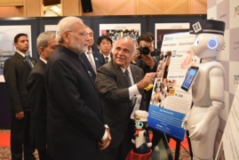Ryuko Hira guiding Prime Minister of India H.E. Narendra Modi at the JNTO Robot Pavilion during his State visit in October 2018