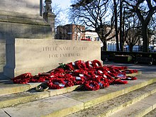 Poppy wreaths laid around the Stone of Remembrance Southampton Cenotaph with Flowers.jpg