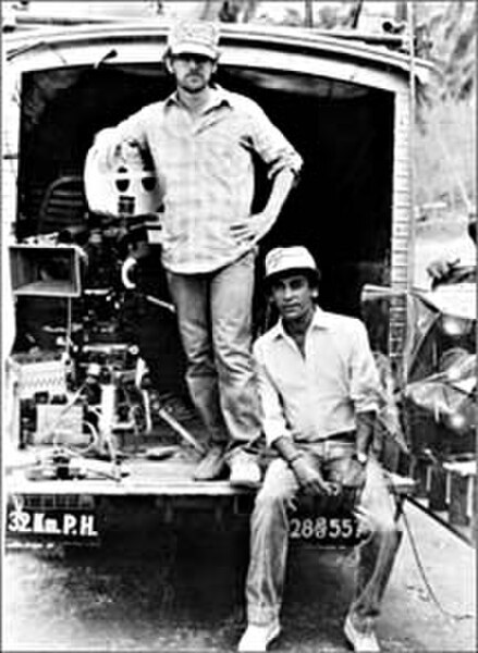 Steven Spielberg (standing) with Chandran Rutnam in Sri Lanka, during the production of Indiana Jones and the Temple of Doom (released 1984)