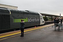 A group of young trainspotters at Taunton railway station in front of a Class 43 operated by RailAdventure. Taunton - Rail Adventure 43484 draws a crowd.JPG