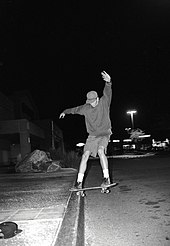 Former guitarist Tom DeLonge performing a slappy in Target parking lot in the early 1990s. Bassist Mark Hoppus specifically references these memories. Tom Delonge slappy at Target parking lot.jpg