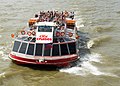 River Thames, London. Tourist vessel heading down-stream.