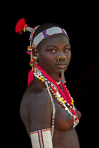 Portrait of young woman from the Laarim Tribe, Kimotong, South Sudan