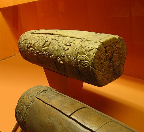 Two Aztec slit drums (teponaztli). The characteristic "H" slits can be seen on the top of the drum in the foreground.