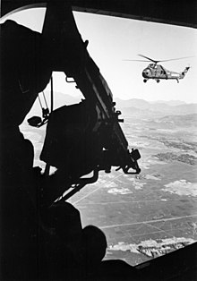 U.S. Marine Corps UH-34Ds over Mekong Delta. UH-34D door gun USMC Vietnam 1965.JPEG