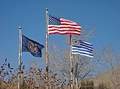 United States flag (center) pre-2011 Utah state flag (left) and the Mormon pioneers flag (right) USutahensign.jpg
